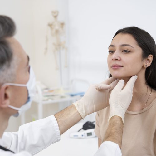 doctor-performing-routine-medical-checkup
